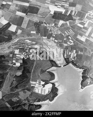 ROYAL AIR FORCE, 1942-1945. - Copy negative created from material loaned to the museum. Image depicts: Overhead aerial reconnaissance view of the breached Moehne Dam, taken by a Supermarine Spitfire of No.541 Squadron Royal Air Force. Note the much reduced outflow from the breach, and the low level of the lake, indicating that the photograph was taken later on 17th, or possibly 18 May 1943. A black and white copy negative , Stock Photo