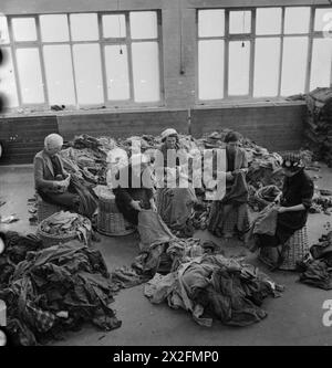 In April 1942, British textile workers process salvaged rags into wool ...