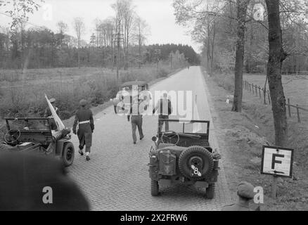 GERMAN DELEGATES MEET BRITISH STAFF OFFICERS PRIOR TO SURRENDER - General Admiral Von Freideberg (Supreme Commander of the German Navy) arriving by car at the meeting place, Quickborn, north of Hamburg. Staff officers of 2nd Army and 21st Army Group are seen going forward to meet him Stock Photo