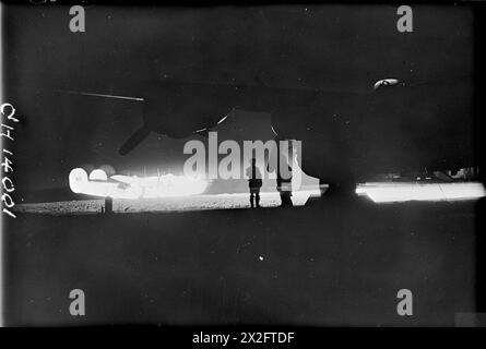 THE BATTLE OF THE ATLANTIC 1939-1945 - Anti-Submarine Weapons: A Royal Air Force Liberator illuminated by a Leigh Light on the airfield at St Eval Royal Air Force Stock Photo