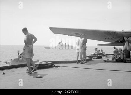 WITH HMS INDOMITABLE. AUGUST 1944, ON BOARD THE AIRCRAFT CARRIER AS SHE ...