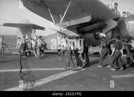 WITH HMS INDOMITABLE. AUGUST 1944, ON BOARD THE AIRCRAFT CARRIER ...