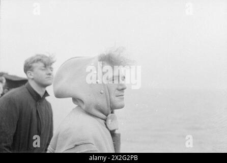 WITH A DESTROYER FLOTILLA AT SEA. AUGUST 1940, ON BOARD SHIPS OF THE FLOTILLA. - A study of a sailor on the look-out with his hair blowing in the wind on board HMS JUPITER Stock Photo