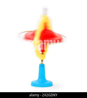 spinning red, blue and yellow whirligig, children toy isolated on white Stock Photo