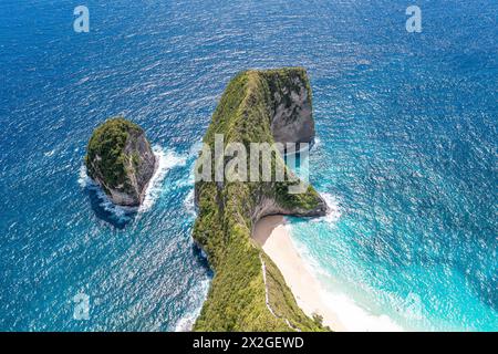 Sea, rocky mountains covered with forest. Big stones in water. Vacation. Klungkung. Bali Indonesia Stock Photo