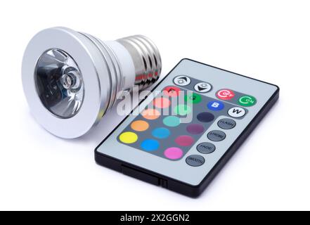 Multi colour LED light bulb and remote control with some several multi-colored buttons Stock Photo