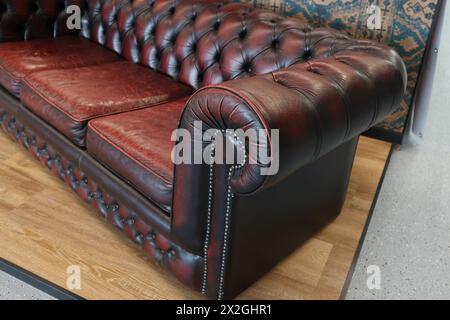 Fragment of an old leather sofa. Stock Photo