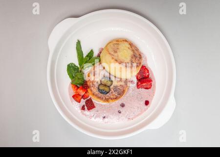 Delicious cottage cheese pancakes made with healthy ingredients, rich in protein and calcium, perfect for a nutritious breakfast option. Stock Photo