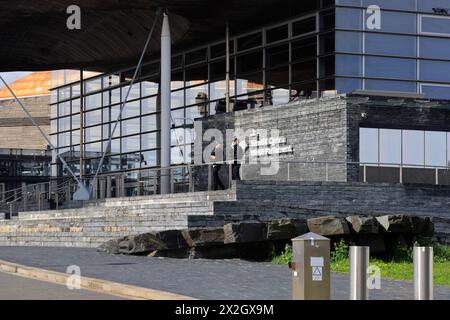 Welsh Parliament building with two armed policemen guarding the entrance. Taken April 2024 Stock Photo