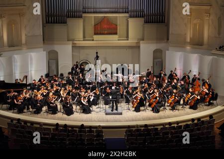 MOSCOW - FEBRUARY 26: Conductor Anatoly Levin directs Symphony Orchestra of Moscow State Conservatory named after P. Tchaikovsky in Tchaikovsky Concer Stock Photo