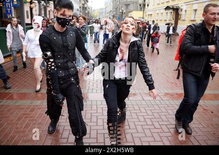 MOSCOW - MAY 14: Unidentified participants of Zombie Parade and casual passersby on Old Arbat, May 14, 2011, Moscow, Russia. Stock Photo