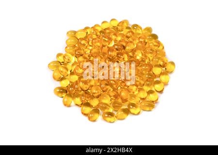 A group of yellow capsules isolated on a white background. Stock Photo