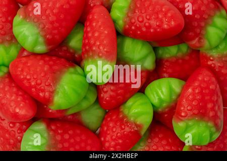 Jelly strawberry candies isolated on a white background. Top view. Delicious gelatin candies. Stock Photo