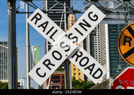 Miami, Florida, USA - 4 December 2023: Sign warning drivers of a railroad crossing in the city centre Stock Photo