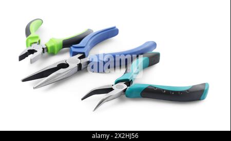 Different pliers isolated on white. Construction tool Stock Photo
