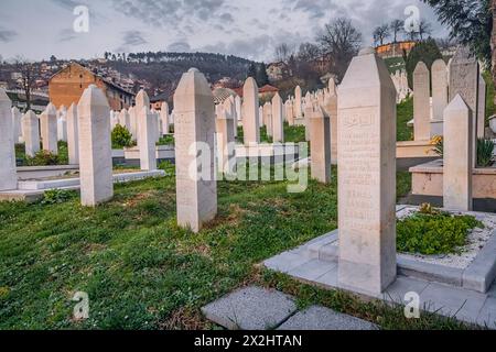 15 March 2024, Sarajevo, Bosnia and Herzegovina: muslim tombstones in the graveyard near mosque Stock Photo