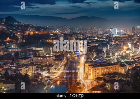 The picturesque cityscape of Sarajevo bathed in the soft glow of twilight invites travelers to explore its historic landmarks and immerse themselves i Stock Photo