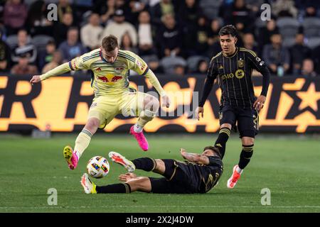 New York Red Bulls forward Cameron Harper (17) avoids a slide tackle by LAFC midfielder Ryan Hollingshead (24) during a MLS match, Saturday, April 20, Stock Photo