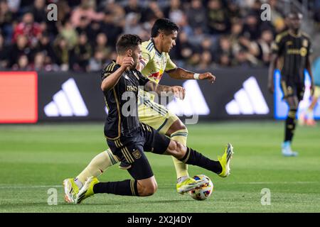 LAFC midfielder Ryan Hollingshead (24) challenges New York Red Bulls midfielder Wikelman Carmona (19) during a MLS match, Saturday, April 20, 2024, at Stock Photo