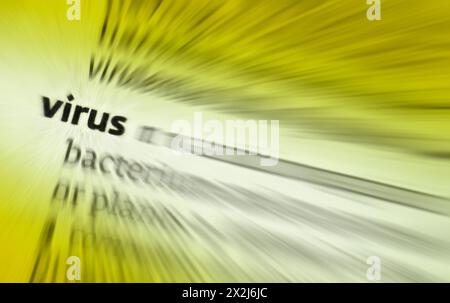 1: an infective agent able to multiply within the living cells of a living host. 2: a piece of computer code that is capable of copying itself and des Stock Photo