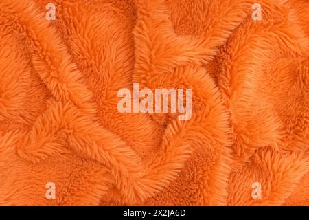 Bright orange faux fur texture, fabric background Stock Photo
