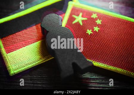 Black Figure On The Flags Of Germany And China, Symbolic Photo Of ...