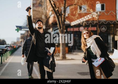 Young business professionals engage in an outdoor strategy session in a bustling city environment, focusing on market trends and success. Stock Photo
