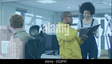 Image of statistical data processing over diverse man and woman discussing at office Stock Photo