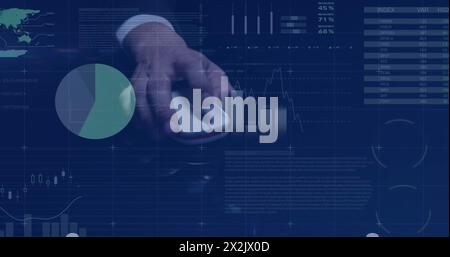 Image of financial data processing over hand of caucasian businessman using computer mouse Stock Photo