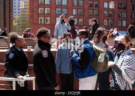 New York, USA. 22nd Apr, 2024. Pro-Palestine protesters talk to campus security guards during a demonstration at New York University. Pro-Palestine demonstrators rallied at New York University in Manhattan, New York City condemning the Israel Defense Forces' military operations in Gaza. Since Monday morning, students and pro-Palestine activists at NYU have held a sit-in protest on campus, forming a 'Gaza Solidarity Encampment.' Credit: SOPA Images Limited/Alamy Live News Stock Photo