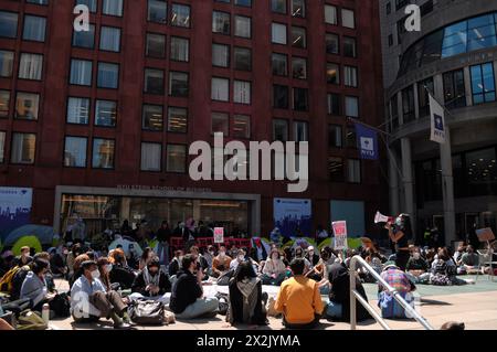 New York, USA. 22nd Apr, 2024. Pro-Palestine protesters hold placards expressing their opinion as they participate in a sit-in demonstration at New York University. Pro-Palestine demonstrators rallied at New York University in Manhattan, New York City condemning the Israel Defense Forces' military operations in Gaza. Since Monday morning, students and pro-Palestine activists at NYU have held a sit-in protest on campus, forming a 'Gaza Solidarity Encampment.' Credit: SOPA Images Limited/Alamy Live News Stock Photo