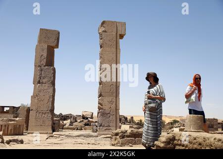 Aswan, Egypt. 22nd Apr, 2024. Tourists visit the ruins of Khnum Temple on the Elephantine island in Aswan, Egypt, April 22, 2024. Elephantine island contains many archaeological sites. Credit: Ahmed Gomaa/Xinhua/Alamy Live News Stock Photo