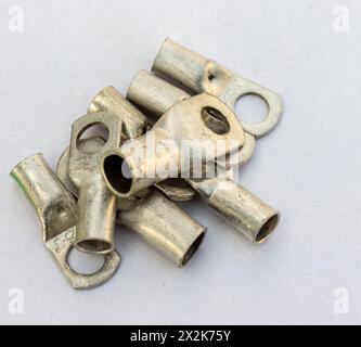 Cable terminal brass several pieces on white isolated background Stock Photo