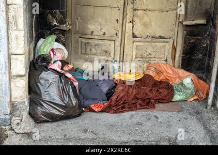 Tehran, Iran- January 14, 2023: A poor man sleeps on the street Stock Photo