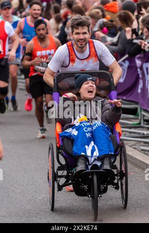 Comedians Rosie Jones and Ivo Graham cross the finish line during the