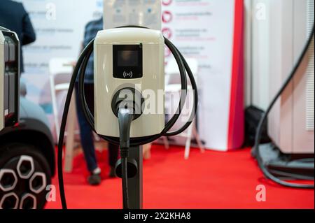 Electric car charging station on blurred background, eco friendly technology, close-up Stock Photo