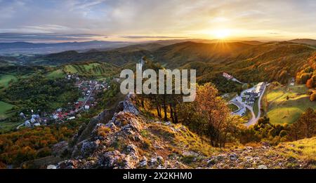 Beautiful Panoramic View of Colourful Fall Forest and Mountains in Vrsatec landscape. Sunset or Sunrise Sky Composite. Slovakia Stock Photo