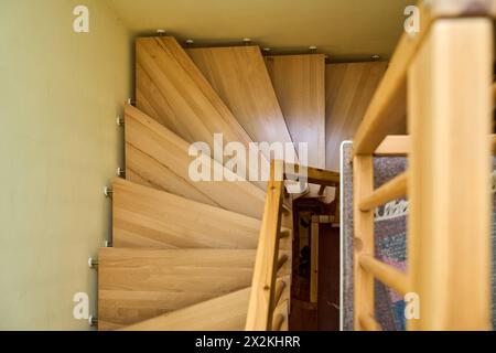Augsburg, Bavaria, Germany - April 13, 2024: Wooden staircase in a residential building. Staircase *** Treppe aus Holz in einem Wohnaus. Treppenhaus Stock Photo
