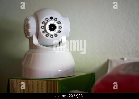 Augsburg, Bavaria, Germany - April 13, 2024: Secret and hidden surveillance camera as burglar protection in a house *** Heimliche und versteckte Überwachungskamera als Einbrecher Schutz in einem Haus Stock Photo