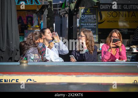 London, UK - 18 May, 2023 - Teenage girls hanging out at Camden market Stock Photo