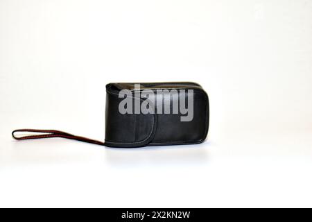 Leather case for storing and transporting a digital camera. Stock Photo
