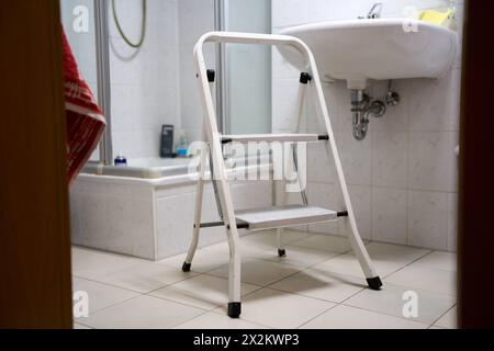 Augsburg, Bavaria, Germany - April 13, 2024: Stepladder in a bathroom. Renovation concept *** Trittleiter in einem Badezimmer. Renovierung Konzept Stock Photo