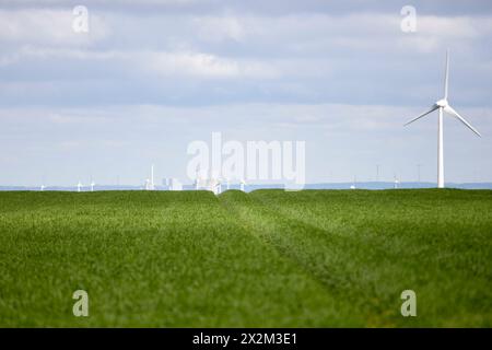Ense, NRW, Germany, 04 21 2024, wind generators, Cooling towers of a power plant in the background Stock Photo