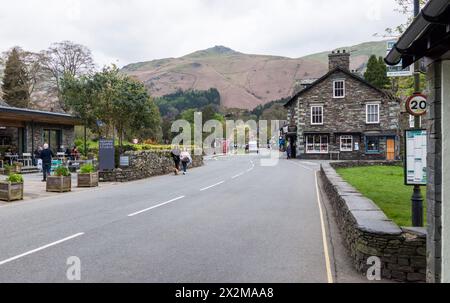 Walkers,tourists stroll through the village of Grasmere in the Lake District National Park,Cumbria,England,UK Stock Photo