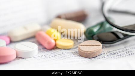 Tablets and glasses. Using medicine pills, patient information leaflet. Medication use guide. Stock Photo