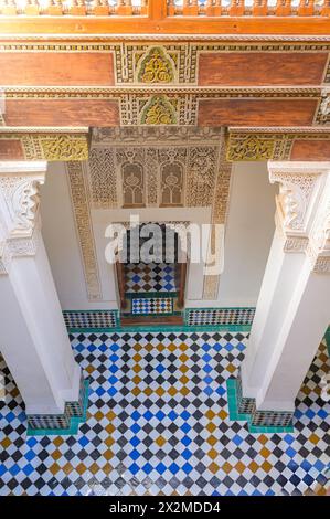 High-angle view capturing the elaborate Moroccan architecture with a detailed wooden ceiling and tiled floor in Morocco. Stock Photo