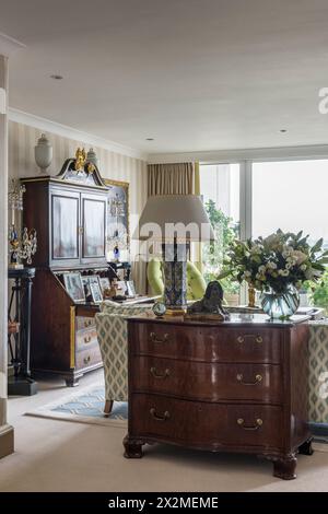 Antique wooden chest of drawers and dresser in Chelsea apartment, London UK Stock Photo