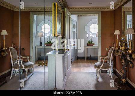 Mirrored hallway entrance to Chelsea apartment giving illusion of space, London UK Stock Photo