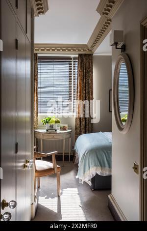 Atmospheric bedroom detail in Chelsea apartment, London UK Stock Photo