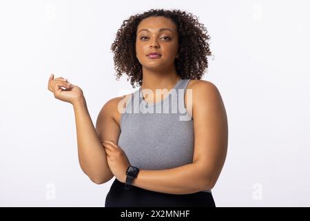 Biracial young female model poses on white background Stock Photo